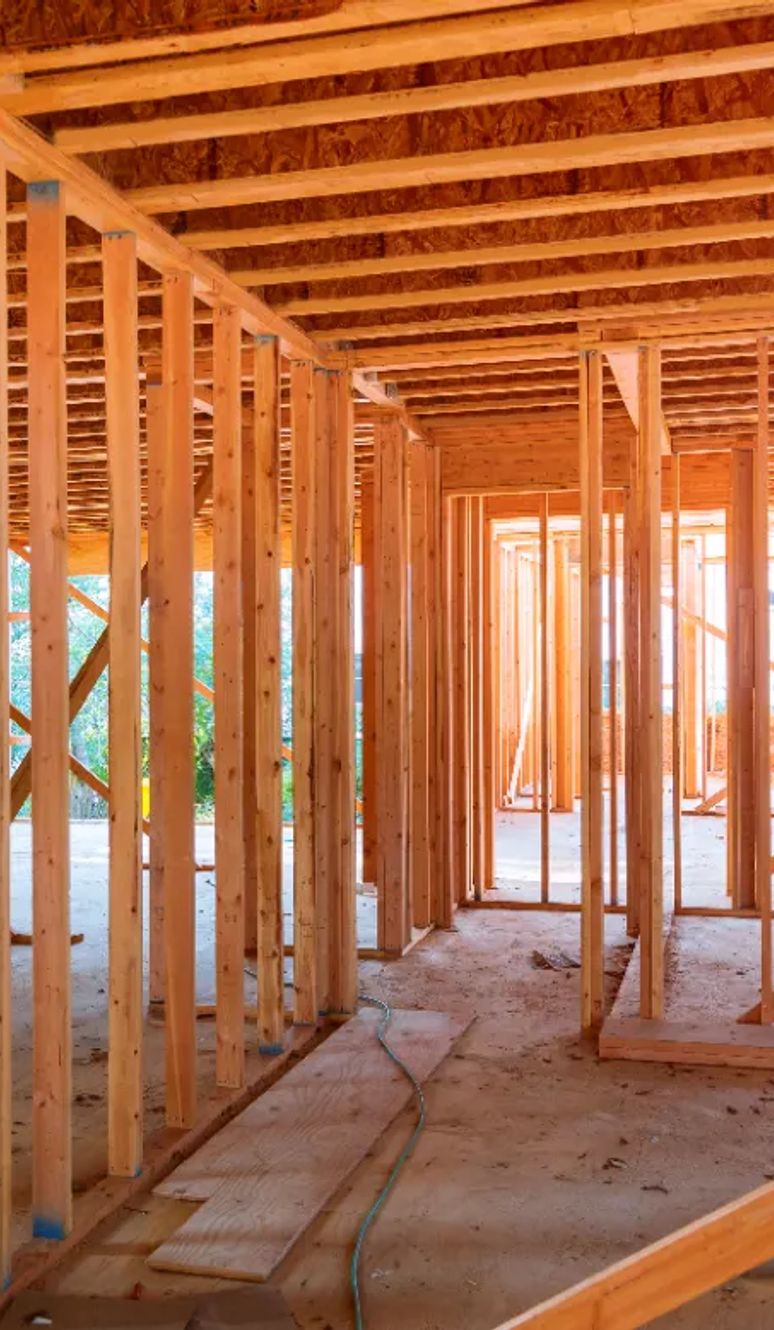 Interior framing of a new home with stud walls and ceiling joists